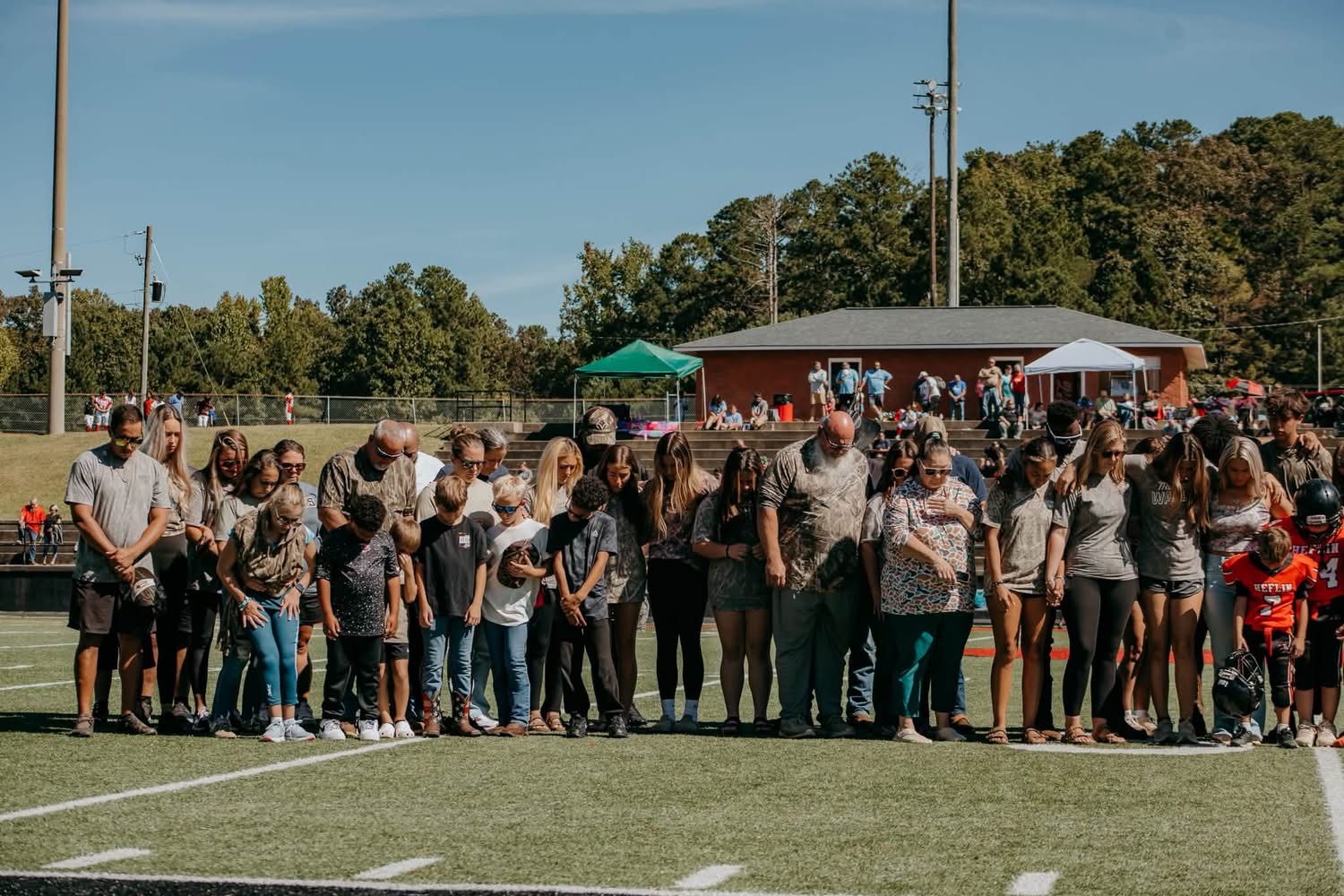 The full community line on the field honoring Coach Brock.
