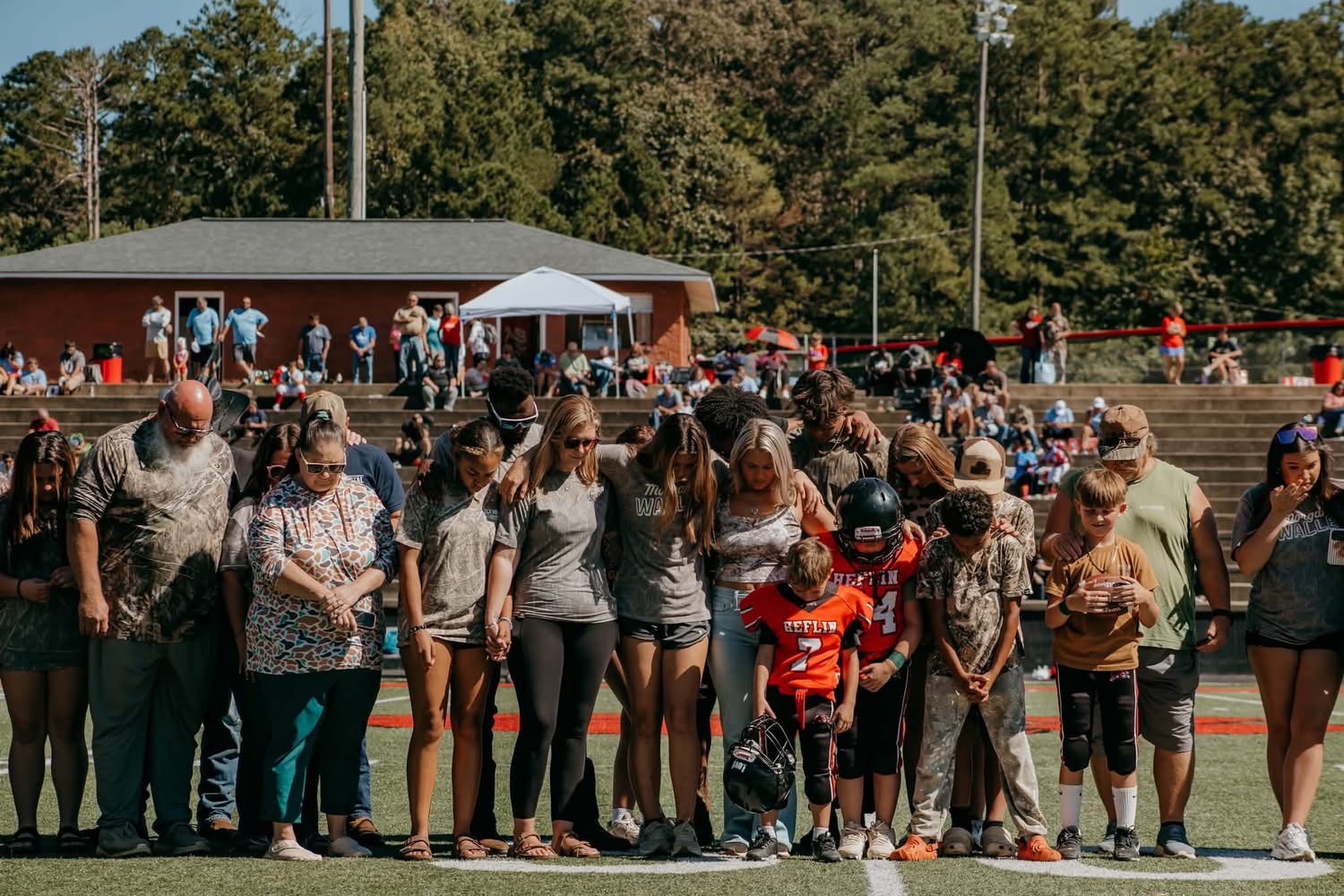 The community gathered shoulder to shoulder at midfield.