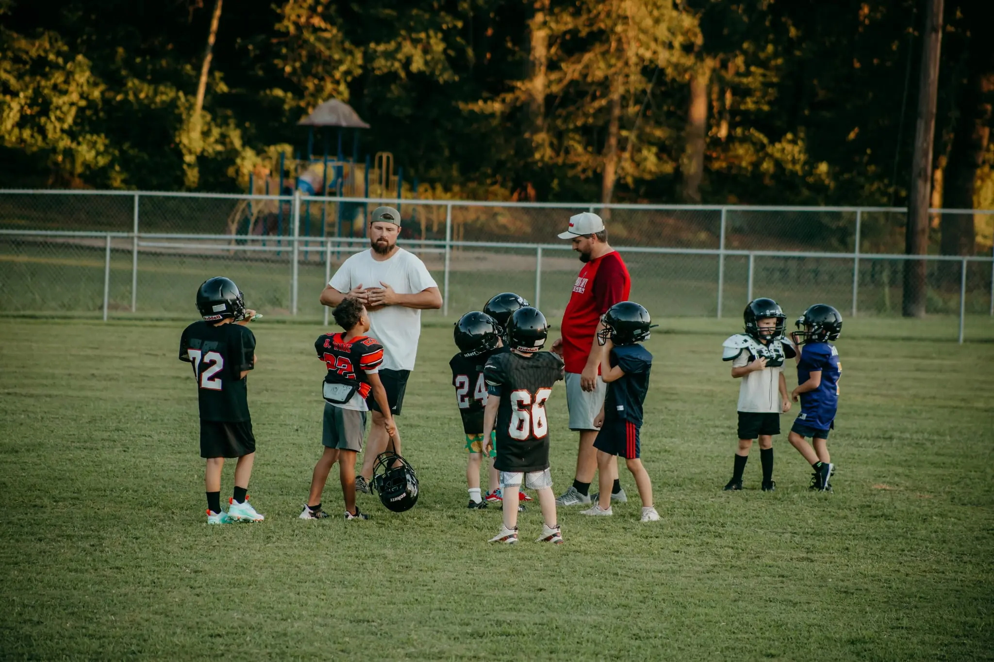 Coaches and players during Heflin Tigers youth football practice